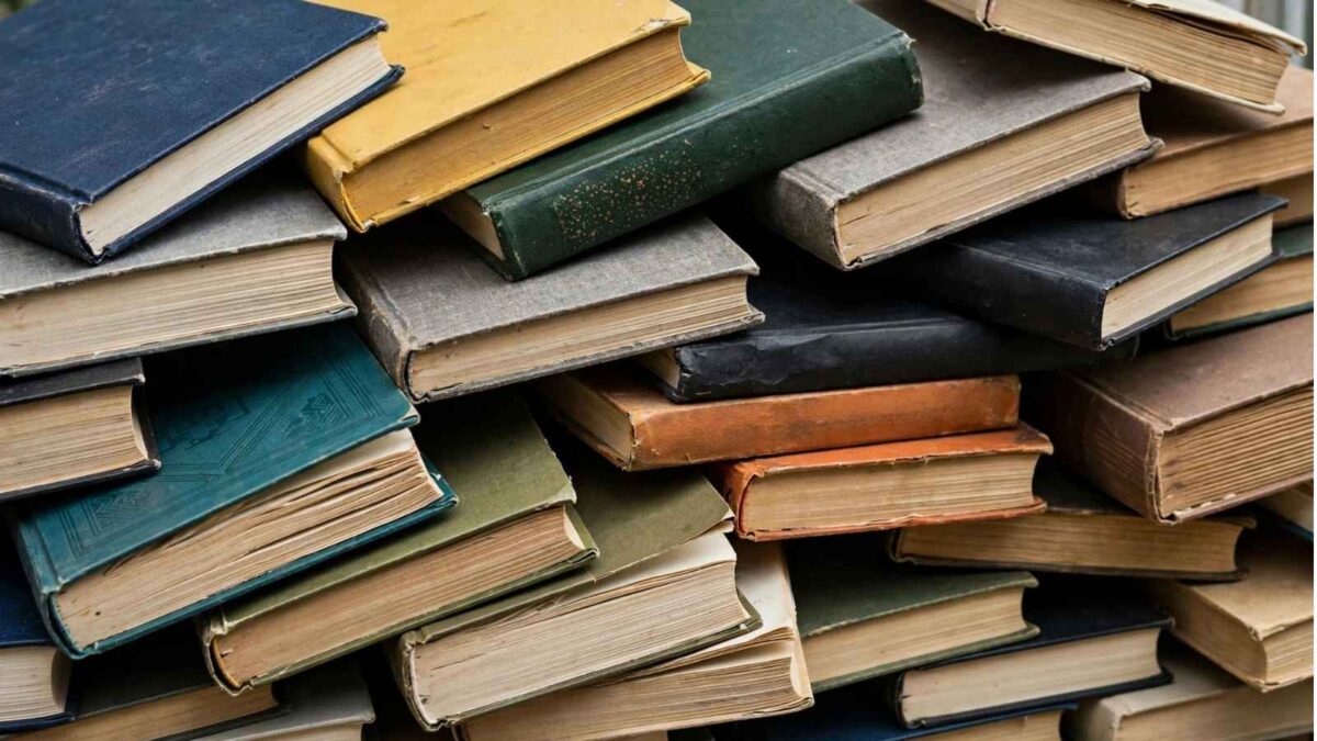 A pile of messy business books.